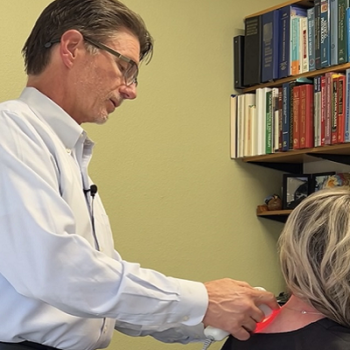Dr Olsen performing laser therapy